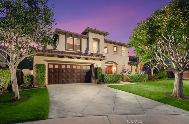 Situated on a quiet cul-de-sac and offers exceptional curb appeal and one of the few private driveways in this  community.