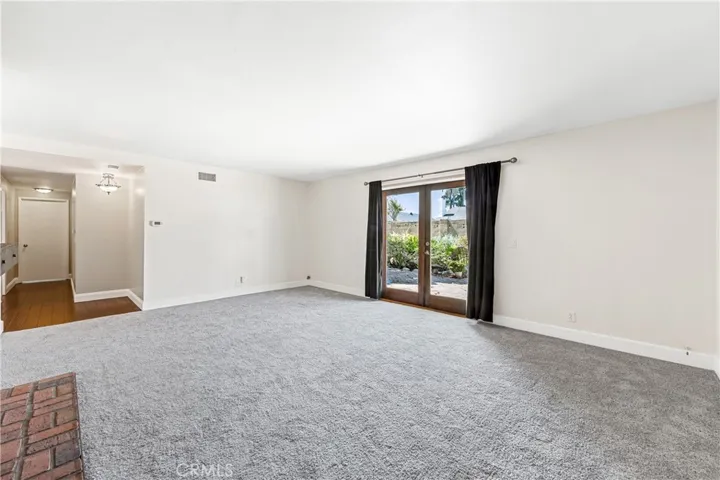 Living room has a slider to the backyard.
