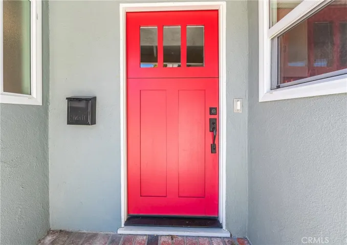 Custom Dutch front door welcomes you into this warm and charming coastal home.