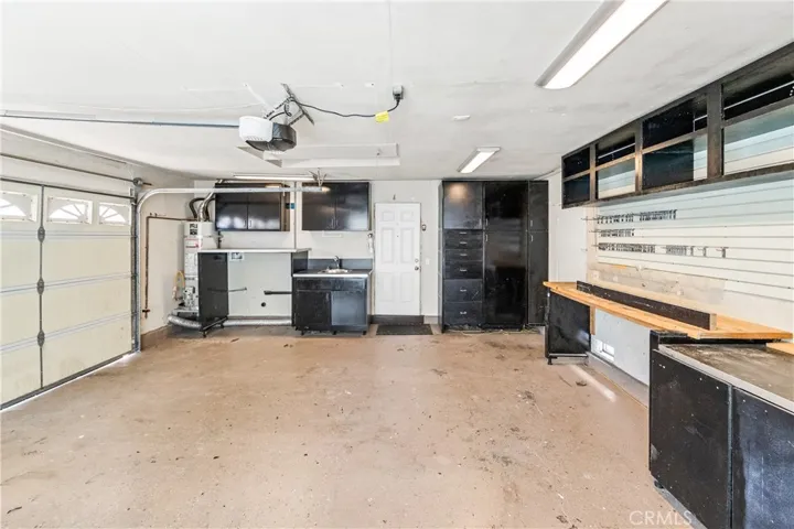 Garage with a workshop and built-ins.