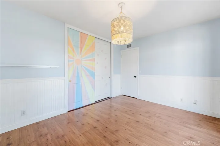Bedroom #2 with a slider to the beautiful backyard.