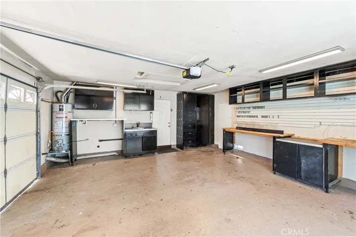 Garage with a workshop and built-ins.