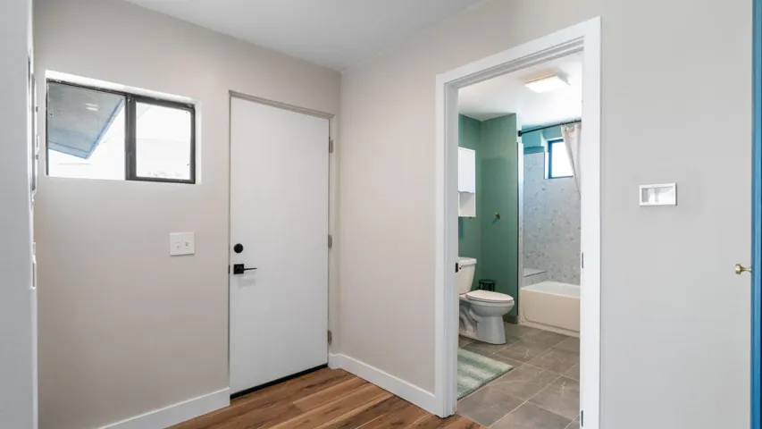 Hallway by bathroom back patio area