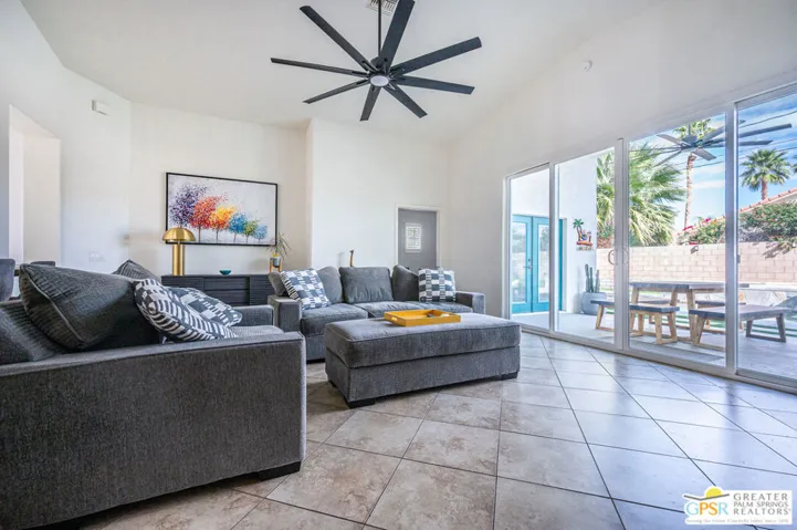 open TV room with pool views