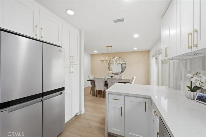 Kitchen opens to dining room