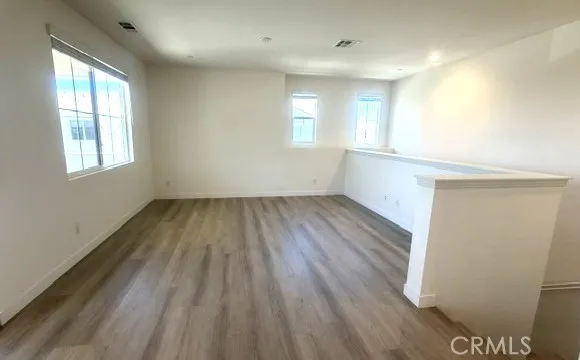 spacious living room~ Newly updated wood floors