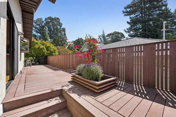 Expansive outdoor deck area featuring composite decking with integrated steps