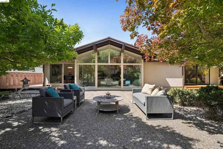 Expansive glass wall facade with A-frame architectural details