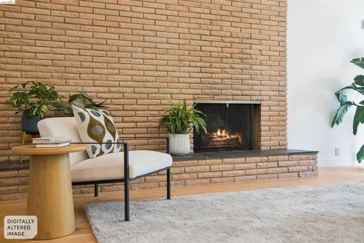 Brick fireplace with a stone hearth and a metal firebox