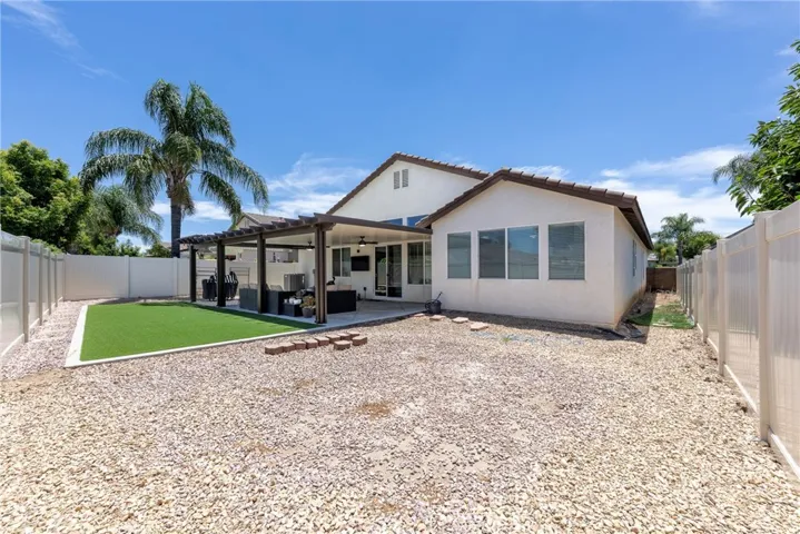 Low Maintenance Large Back Yard includes gravel and artificial turf