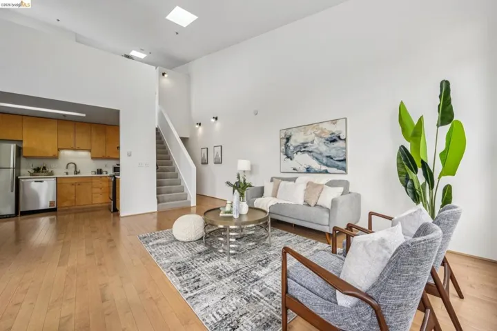 Open-concept living area with high ceilings and skylights