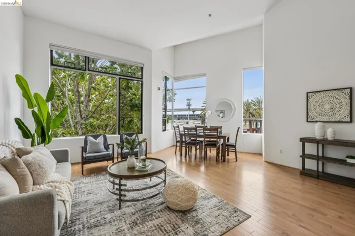 Expansive living area with high ceilings and abundant natural light