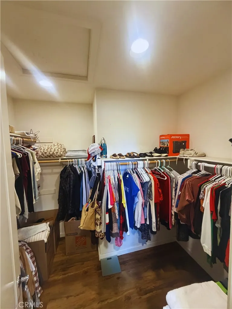 Walking Closet - Image digitally enhanced with AI to remove the seller's personal items for privacy.
