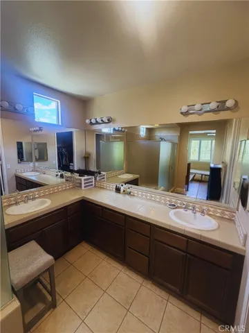 Primary Bath - Image digitally enhanced with AI to remove the seller's personal items for privacy.