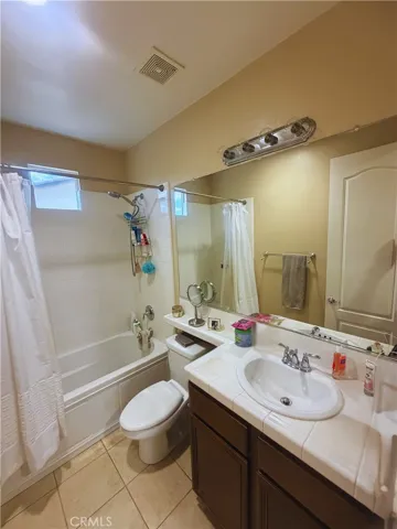 Bath 1 - Image digitally enhanced with AI to remove the seller's personal items for privacy.