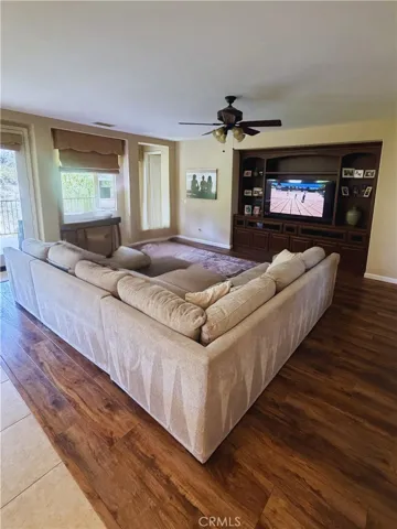Living room- Image digitally enhanced with AI to remove the seller's personal items for privacy.