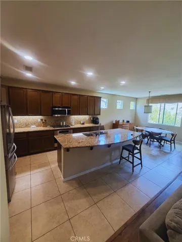 Kitchen - Image digitally enhanced with AI to remove the seller's personal items for privacy.