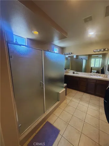 Primary Bath - Image digitally enhanced with AI to remove the seller's personal items for privacy.
