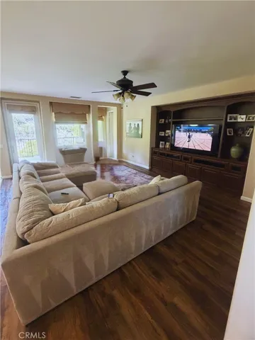 Living room - Image digitally enhanced with AI to remove the seller's personal items for privacy.