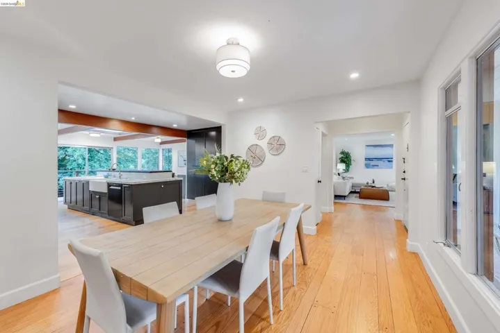 Bright interior featuring wood-finish flooring and white walls