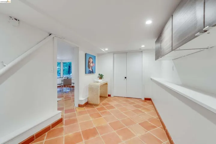 Terra cotta tile flooring throughout the space