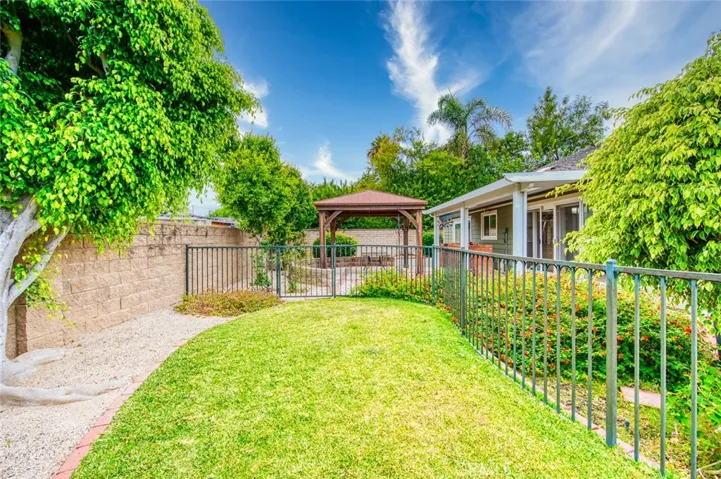Step outside to discover an expansive backyard with endless possibilities. Whether you envision weekend barbecues, outdoor entertaining, lush gardens, a sparkling pool, or your own private retreat, this oversized 10,000 square foot lot provides the space to bring your ideas to life.