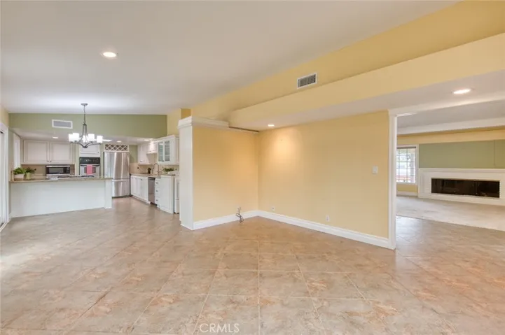 The kitchen opens to the spacious family room that flows into the dining room and living room.