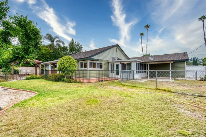 Step outside to discover an expansive backyard with endless possibilities. Whether you envision weekend barbecues, outdoor entertaining, lush gardens, a sparkling pool, or your own private retreat, this oversized 10,000 square foot lot provides the space to bring your ideas to life.