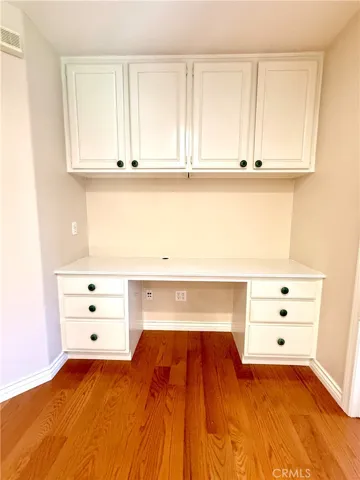 Study area with desk and cabinets