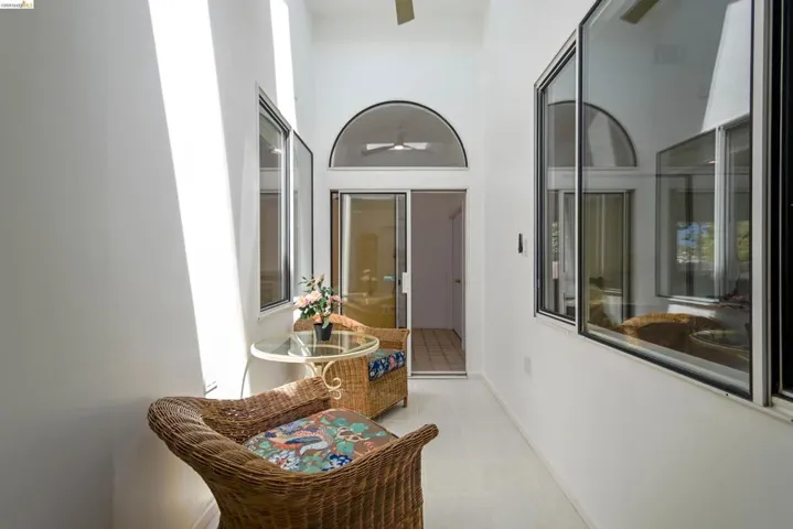 Sunlit interior corridor with high vaulted ceilings