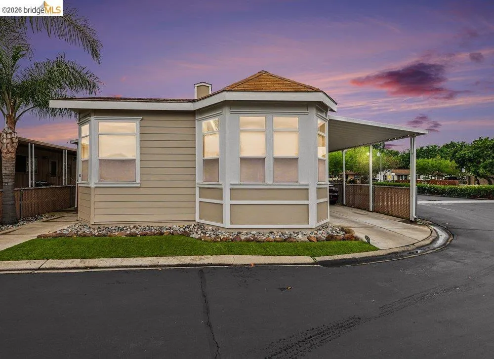 View of front of property featuring a carport View of front of property featuring a carport