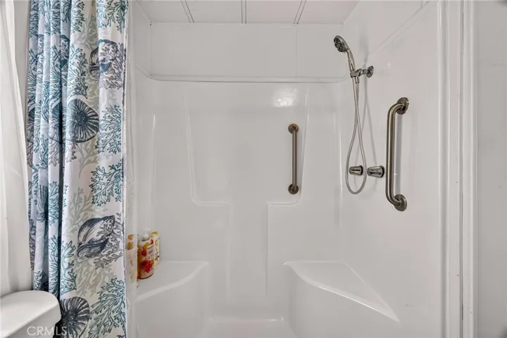 Primary bathroom -walk in shower with dual seats.