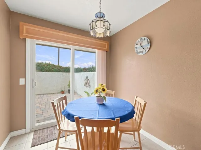 dining area with sliding door to paito