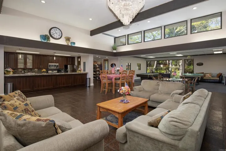 Includes full kitchen, gym, billiards, pingpong, dining tables, great room with fireplace, library