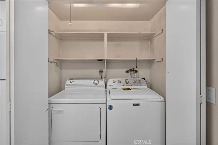 Washer and dryer are located in the closet in the kitchen.