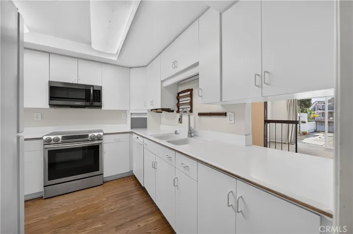 Current kitchen configuration offers abundant storage and counter space.