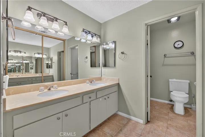 Primary bathroom with dual sinks.