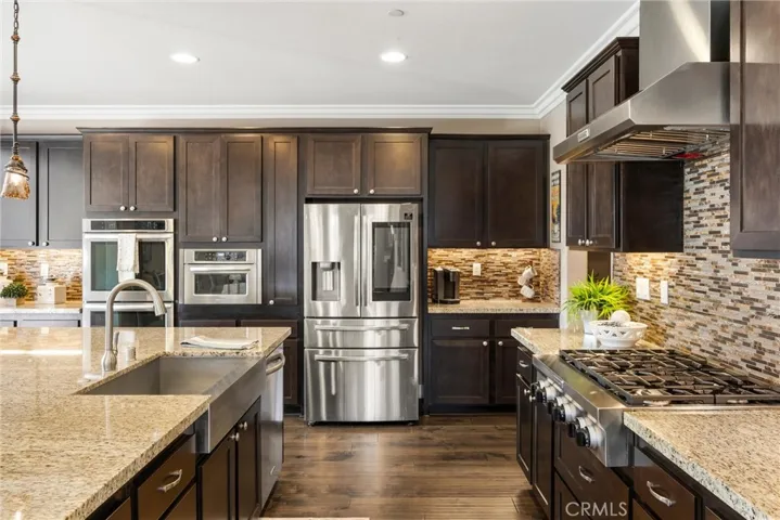 Stainless steel appliances with double oven.