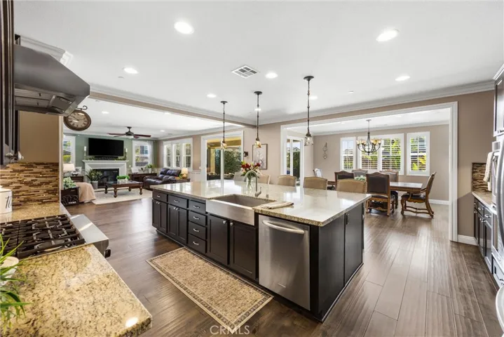 KitchenAid appliances with 6 burner gas cooktop.