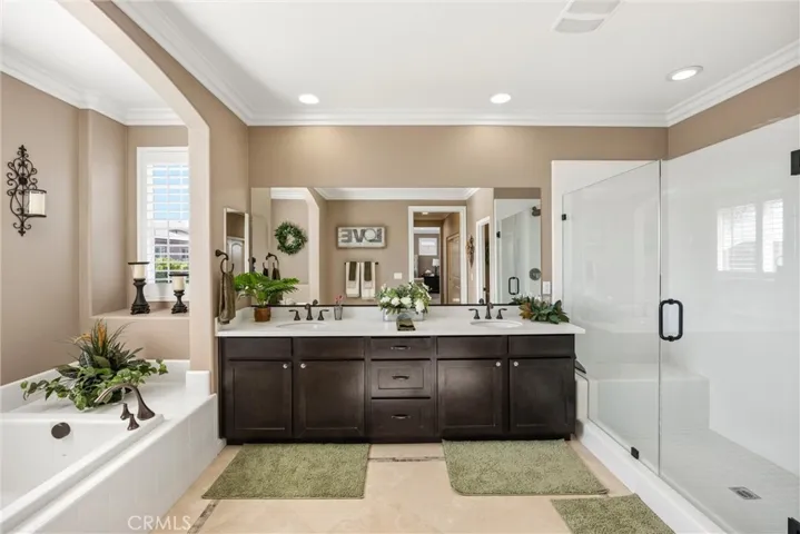 Primary bathroom with Travertine floors.