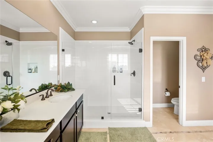 Primary frameless glass shower.