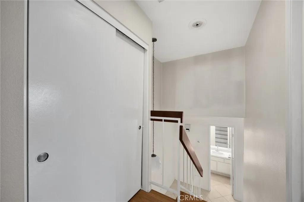 Upstairs hallway with linen closets & storage space