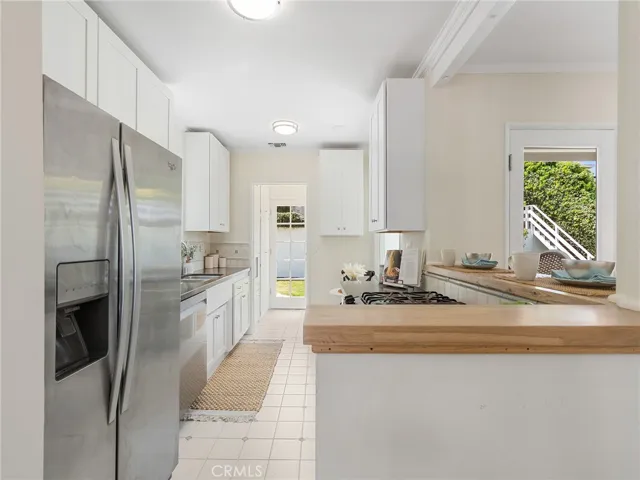 Kitchen with laundry room near the back of the kitchen.