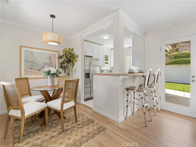 Lovely dining area and view of the kitchen.