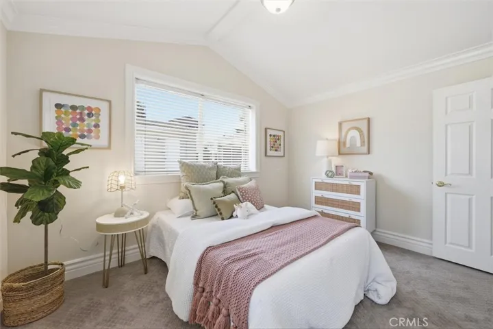 rear guest bedroom with vaulted ceiling