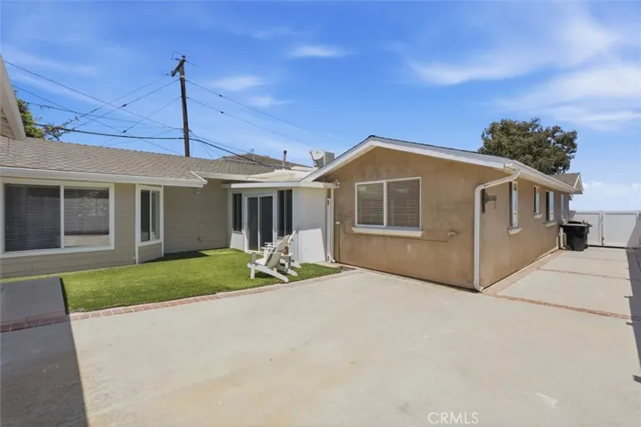 Gated driveway from street to rear detached 2 car garage