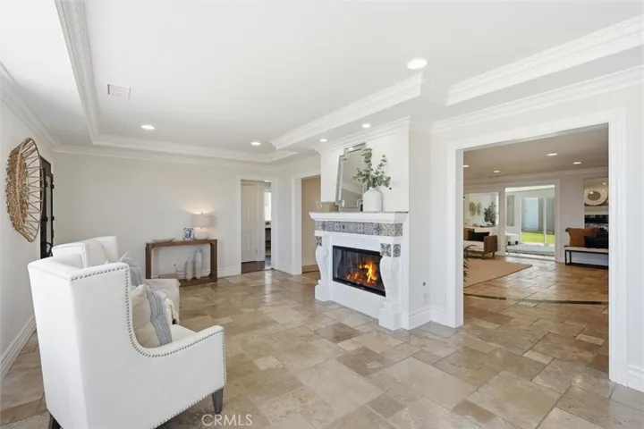 Double sided fireplace from living room to family room