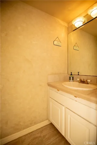 Powder bathroom off of living spaces upstairs