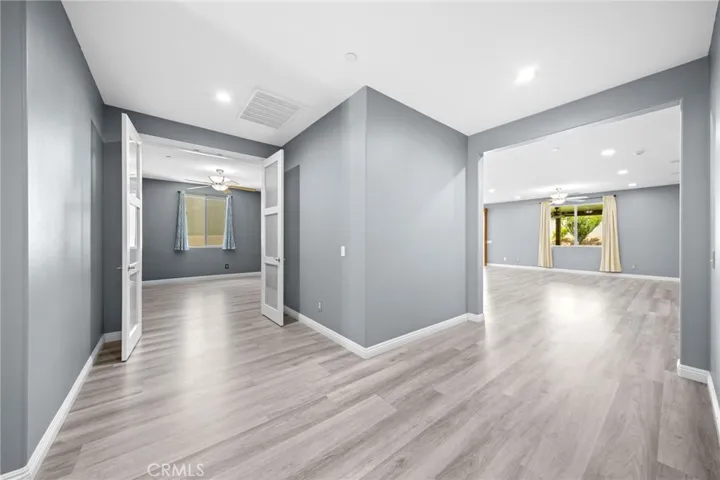 Hall with vantage of den/ office space