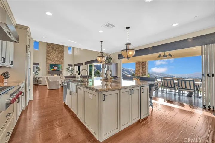 Folding glass walls open the kitchen fully to the California room